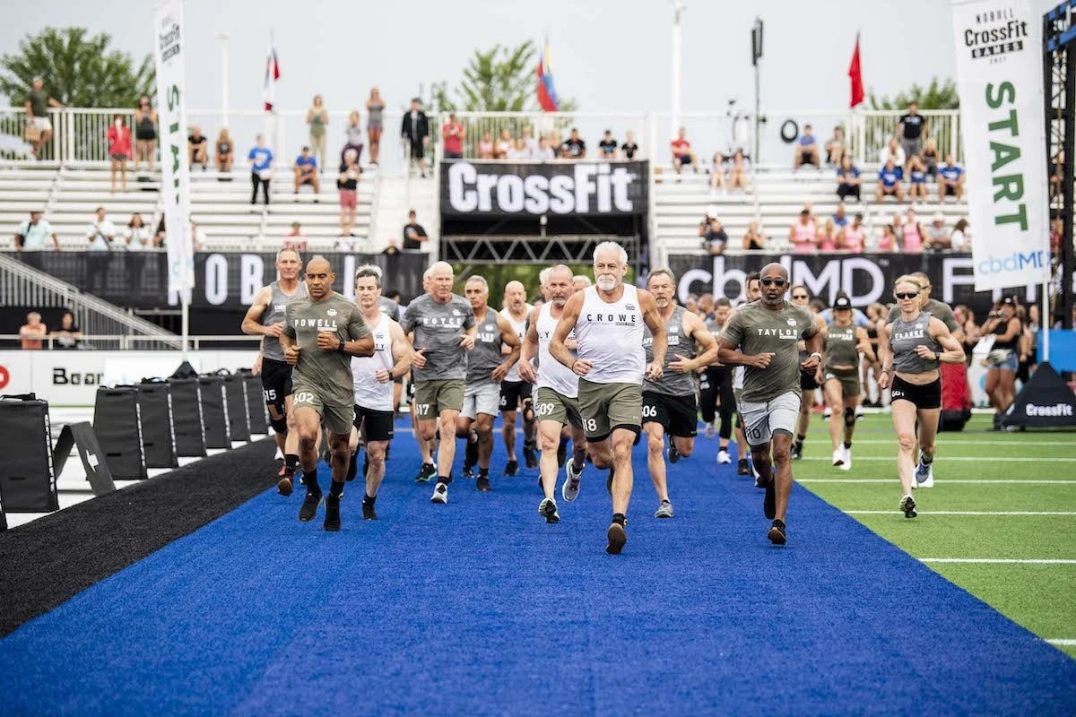 Masters athletes running onto the field at the CrossFit Games