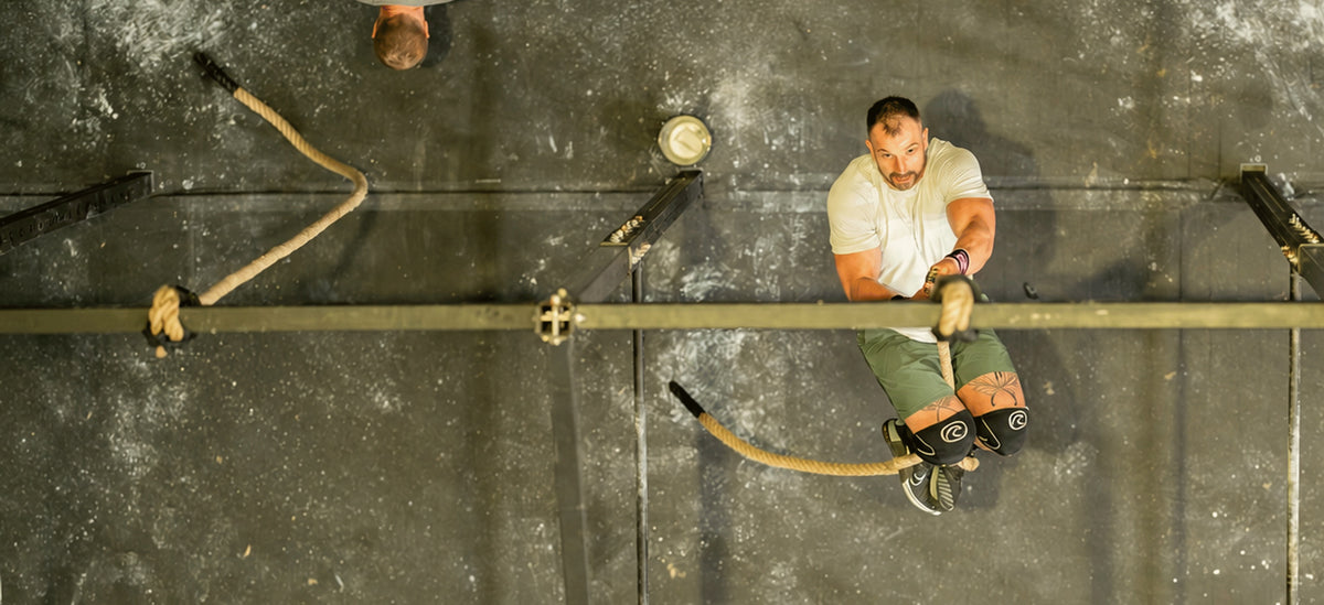 Athlete climbing a rope, seen from above