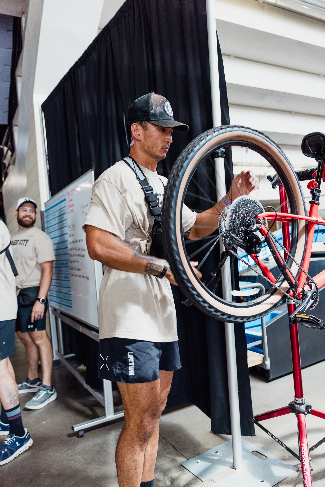A Magic City Games crew member truing a wheel during the event build-out